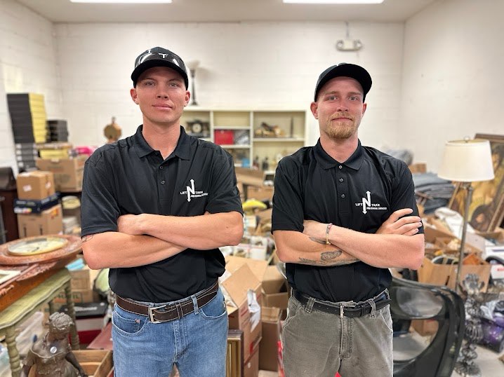 Lift N Take field crew smiling in front of the truck