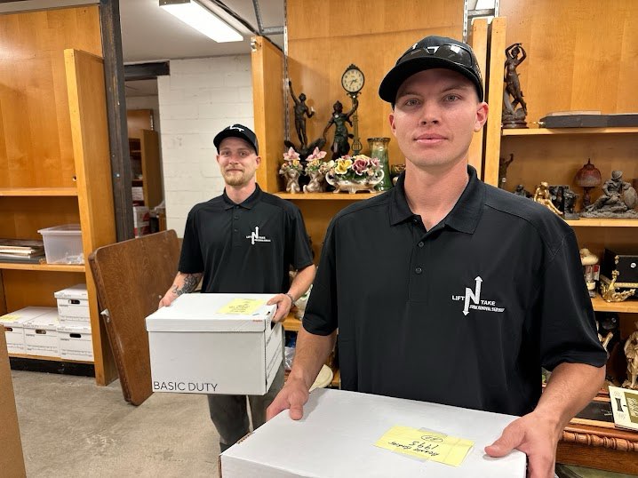 Lift N Take crew posing after a clean garage pickup