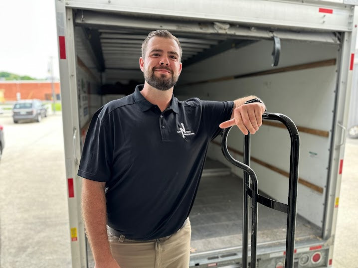Lift N Take team members unloading debris at the yard