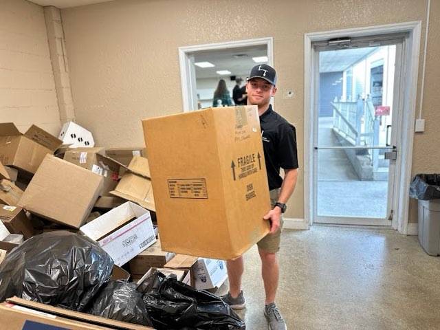 Lift N Take team celebrating a completed junk removal job